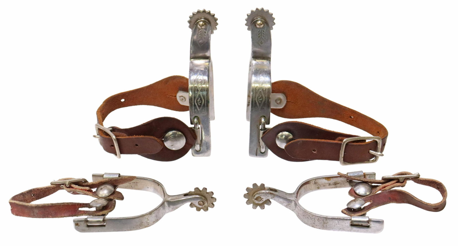 (2) WESTERN STYLE KID-SIZED COWBOY SPURS: (lot of 2 pairs) Kid-sized cowboy spurs, including: (1) outside heelband with engraved detail, 1" rowels, ten points, worn leather straps, yoke: approx 2.5"w, 2.75"d, (1) engraved outside heelband, 1"