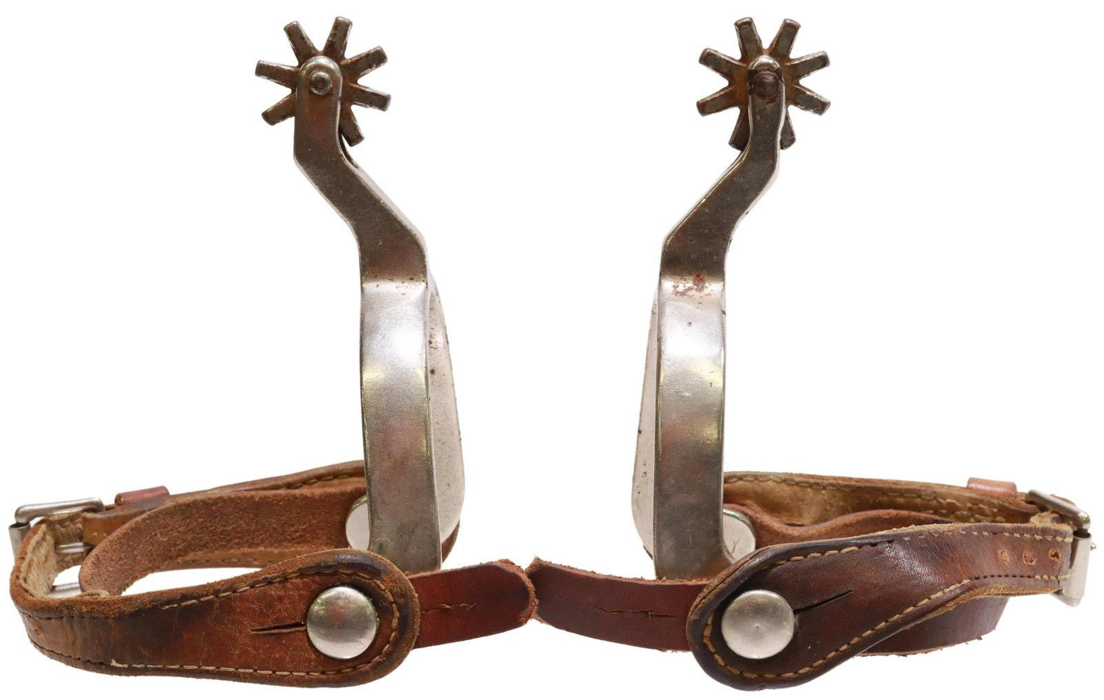 WESTERN NORTH & JUDD IRON COWBOY SPURS: (pair) Western cowboy spurs, North & Judd, plain iron heelband, 1.25" rowels, eight points, leather straps, neck with anchor mark, yoke: approx 3.25"w, 3.35"d, 1lbs total Start Price: $80.00