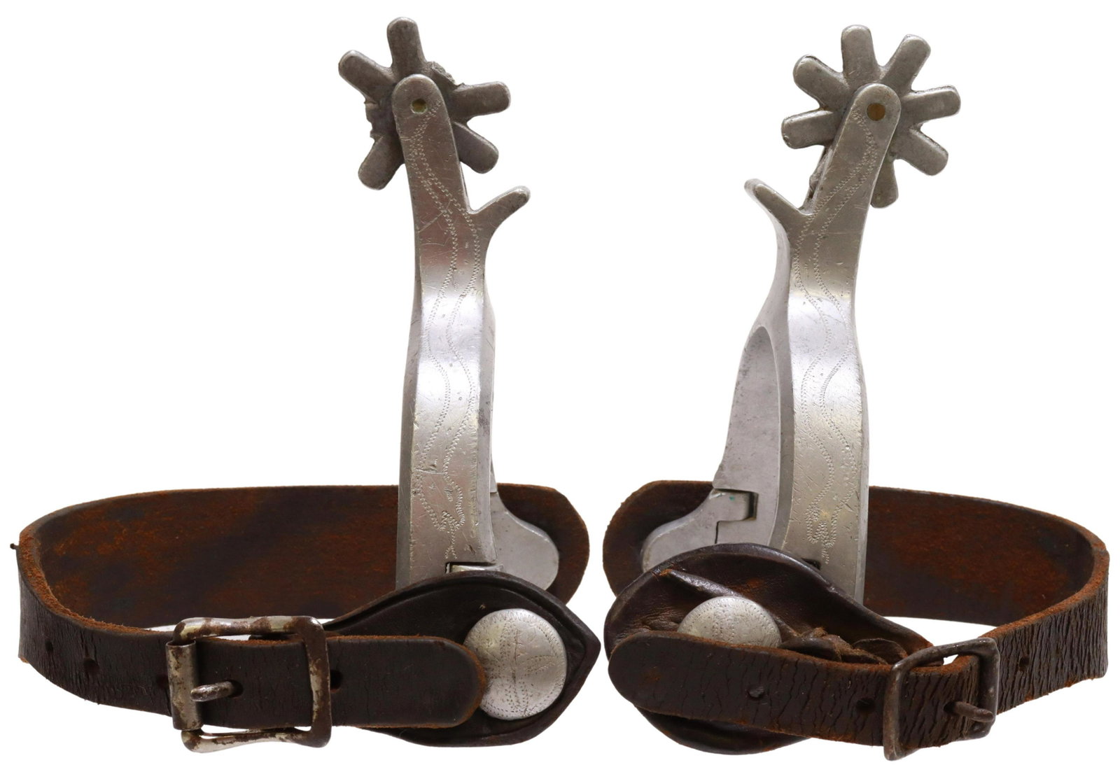 WESTERN ENGRAVED ALUMINUM COWBOY SPURS: (pair) Unusual airplane metal aluminum cowboy spurs, outside heelband engraved with a serpent, 1.5" rowels, eight points, worn leather straps, (one) with loss to two points on rowel, yoke: approx 3.25