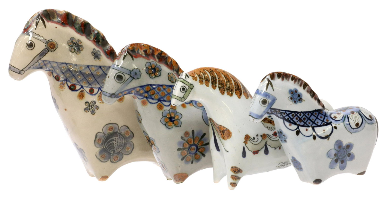 (4) KEN EDWARDS TONALA POTTERY HORSES: (lot of 4) Ceramic horses, Ken Edwards, Tonala, Mexico, in varying sizes, decorated in floral designs, maker's mark underfoot, (one) with chip to base underfoot, largest: approx 8.5"h, 3.25"w, 10"d, s