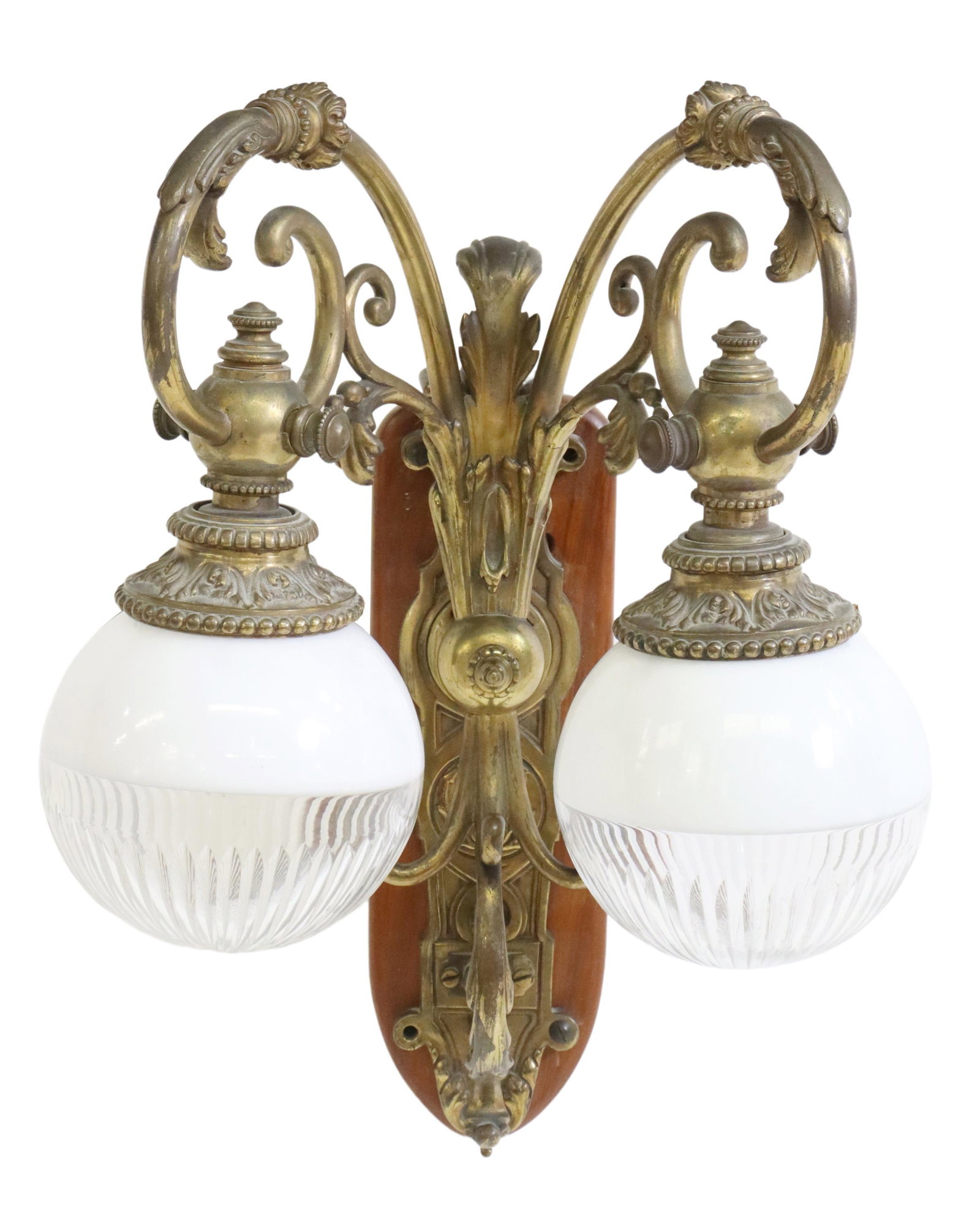 LARGE CONTINENTAL BRONZE TWO-LIGHT SCONCE: Continental patinated bronze two-light sconce, late 19th/ early 20th c., foliate scroll arms ending in white and colorless glass globes, backplate with initial T, mounted on a wood board, in need of w
