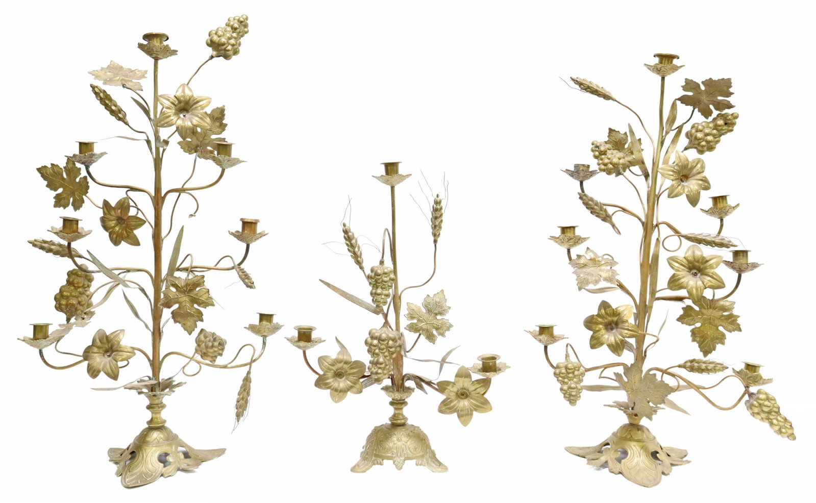 (3) FRENCH BRASS ALTAR CANDELABRA, GRAPES & WHEAT: (lot of 3) French brass altar candelabra, both having foliate bobeches, surmounted with grape clusters, wheat, lily flowers, and leaves, including: (2) seven-light candelabra, rising on tripartite bas