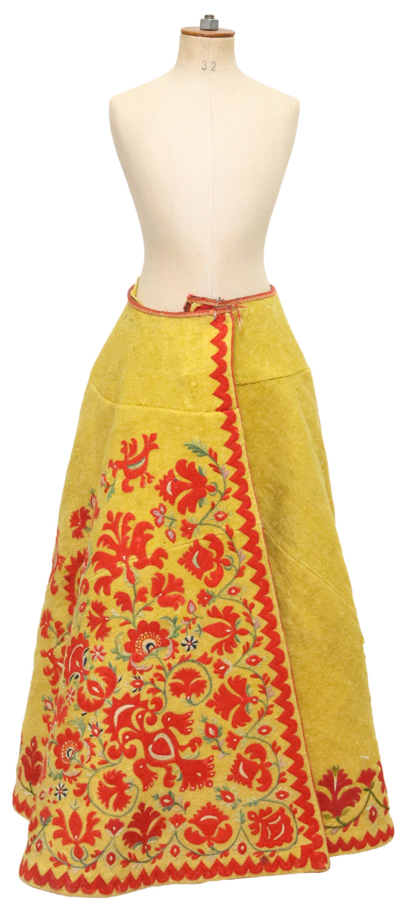 VINTAGE FLORAL EMBROIDERED WOOL SKIRT, MEXICO: Vintage wool skirt, Mexico, having elaborate floral applique and embroidery, intact with some small holes, wear, and insect damage to interior lining, waist to hem: approx 44"l, end to end: approx 89"