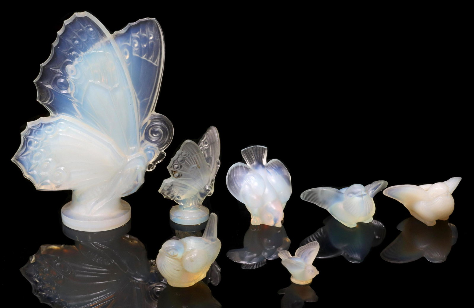 (7) FRENCH SABINO GLASS BUTTERFIES & BIRDS FIGURES: (lot of 7) French opalescent art glass butterfly and bird figures, Sabino, Paris, (one) unmarked, small fleabite chip to large butterfly wings, largest: approx 6.5"h, 4.75"w, 2"d; 2lbs total **Provena