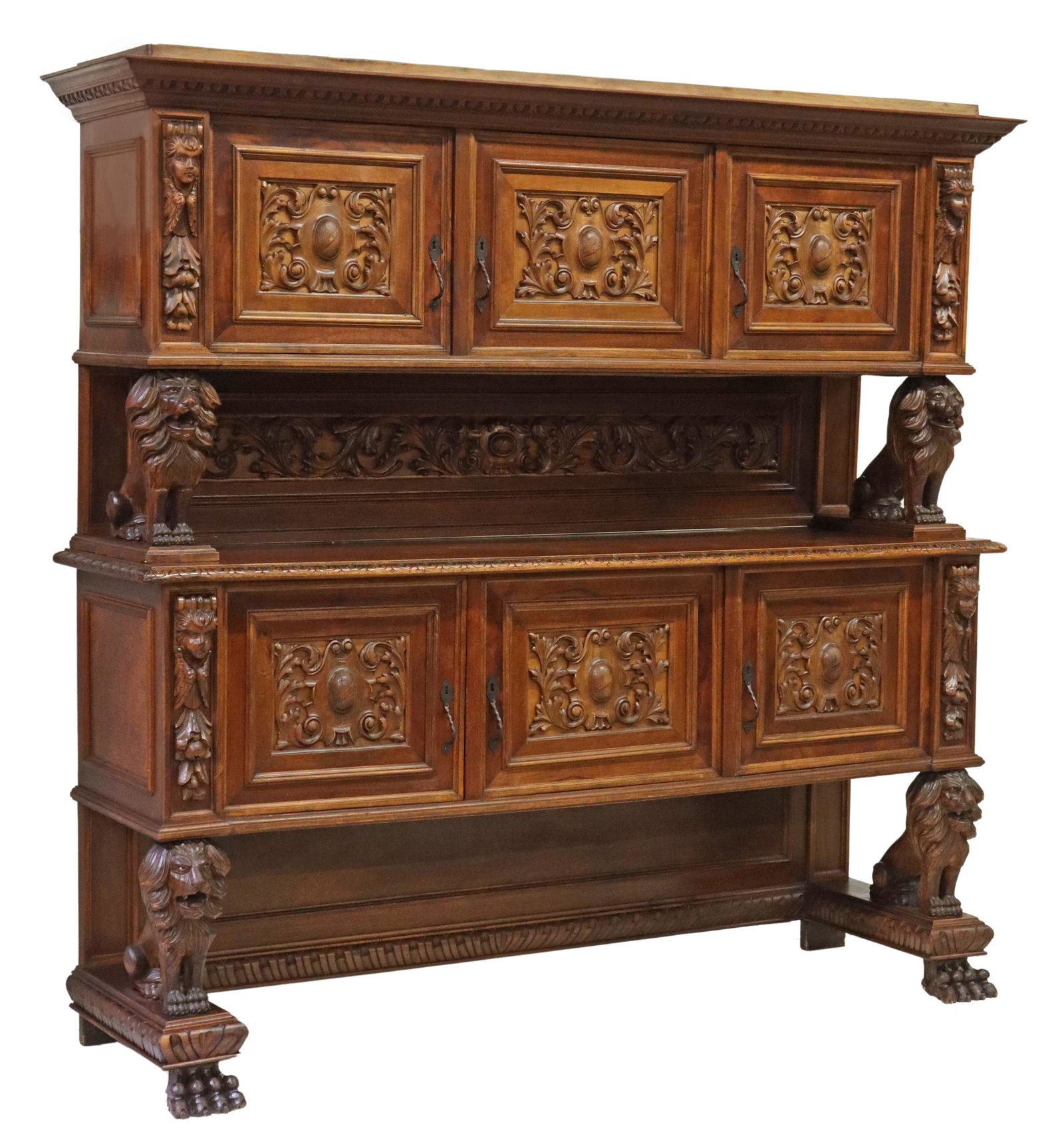ITALIAN RENAISSANCE REVIVAL CARVED SIDEBOARD: Italian Renaissance Revival carved sideboard, early 20th c., having stepped cornice, over three paneled cabinet doors, lower case fitted with three additional cabinet doors, opening to shelved interio