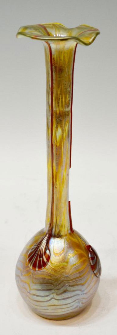 SIGNED LOETZ ART GLASS VASE, 13"H: Loetz iridescent art glass vase, Austria, c. 1900, the flower petal rim over a long neck decorated with three vertical rigaree strands terminating in shell forms on the bulbous base, signed on the pol