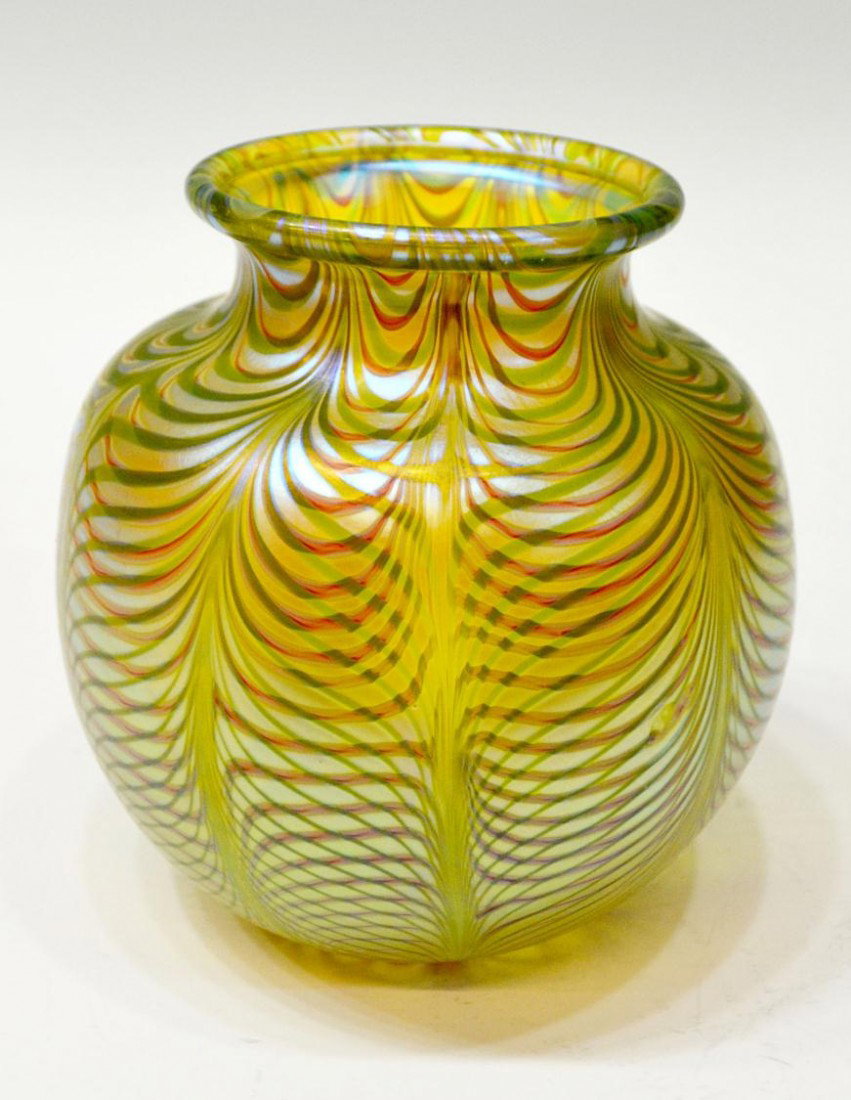 ORIENT & FLUME ART GLASS VASE, 1982: Orient & Flume art glass vase in a pulled feather pattern with contrasting greens and subtle burgundy, marked at base "Orient & Flume, 1982, JN, 101", 6"h, 5.7/8"d, 2lbs Start Price: $100.00