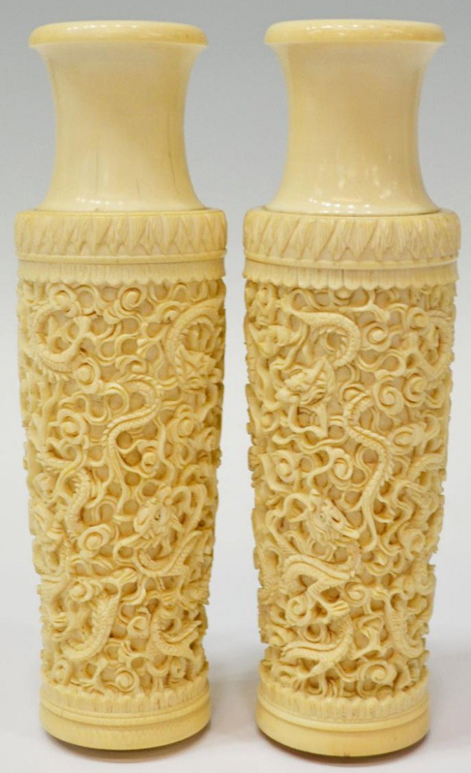 (PAIR) CHINESE CARVED IVORY VASES, DRAGONS: **This item will not be shipped Internationally** (pair) Chinese carved ivory elephant tusks, formed as vases covered with sinuous dragons in clouds, one with chip, both appear to have had bases not p