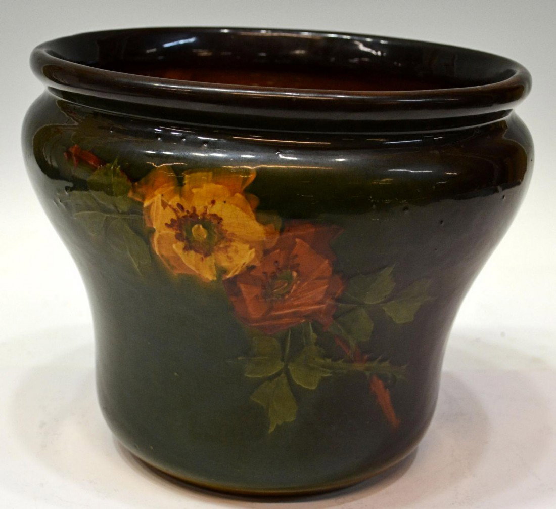 WELLER LOUWELSA DECORATED JARDINIERE: Weller Louwelsa jardiniere, floral decorated against a green and brown, ground, 8.5"h, 10"d, 6.75lbs Start Price: $50.00