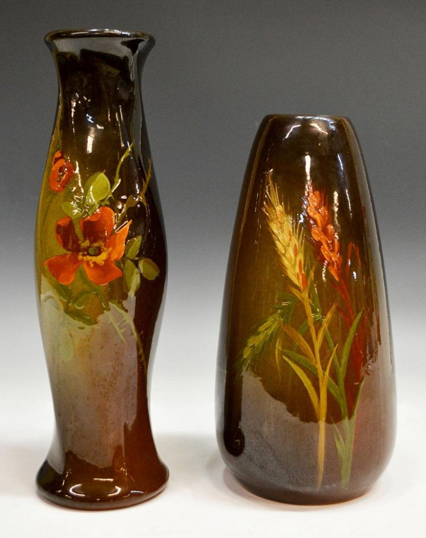 (2) OWENS POTTERY VASES: (lot of 2) Art pottery vases by J.B. Owens Company, Ohio, c. 1900: (1) wheat on a dark brown ground, incised Owens 013 at base, raised .25" not glazed at one side, 11.5"h, 5.25"d; (1) baluster form, f