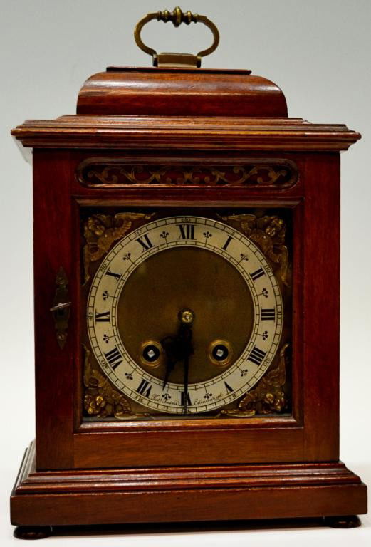 ENGLISH MAHOGANY CASE CARRIAGE CLOCK, R. SAWERS: Mahogany cased carriage clock, c. 1920's, the face corners with winged putti, Roman Numerals at the chapter ring, signed Robert Sawers, Edinburgh, time and strike works marked Coventry Astral (England