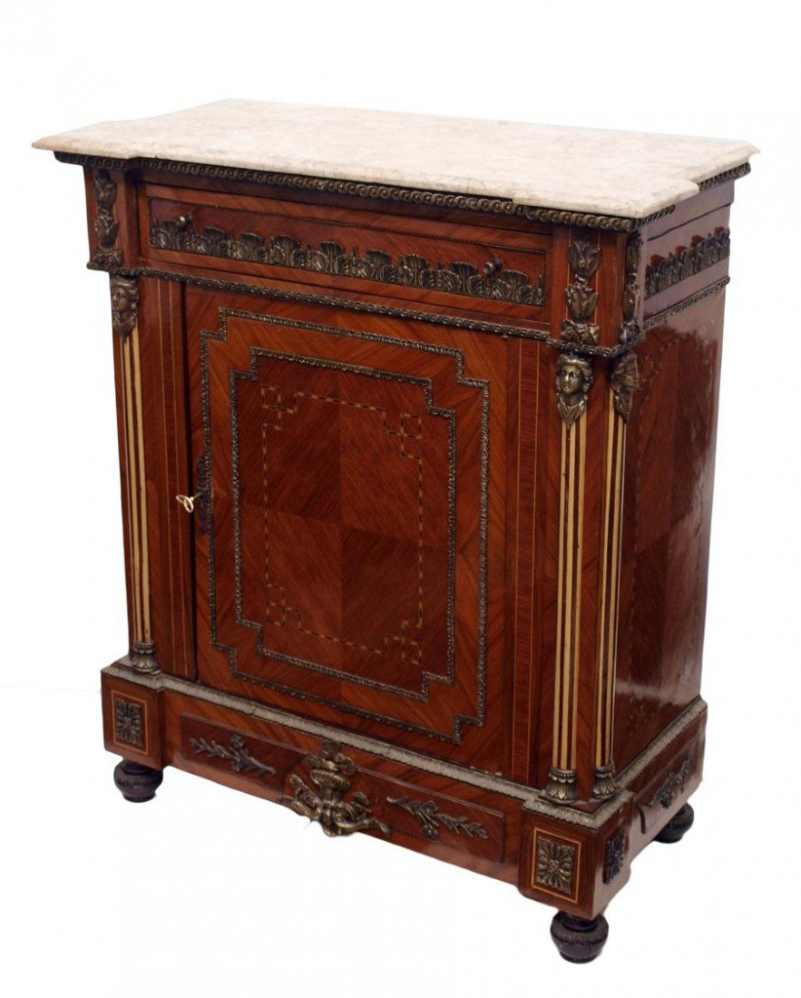 FRENCH STYLE GILT METAL INLAID MARBLE TOP CABINET: Louis XVI style console cabinet, a beveled marble top resting on the case with figural and foliate gilt metal ornamentation and contrasting string inlays throughout, interior shelf, the whole rising o