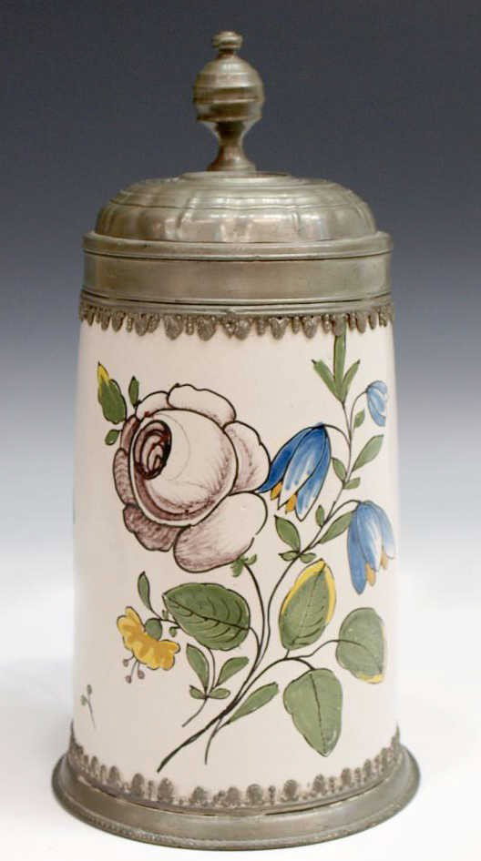 EARLY FAIENCE & PEWTER BEER STEIN, RUSSIAN COIN: Continental faience floral decorated beer stein having a pewter base and lid, the lid with a facsimile of an 18th c. coin bearing the likeness of Anna Ivanovna (Russia, 1693-1740), Empress of Russia 1