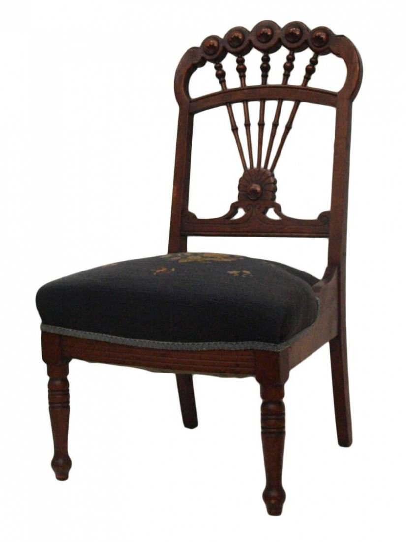 VICTORIAN NEEDLEPOINT CARVED SPINDLEBACK CHAIR: American Victorian oak slipper chair, c. 1900, floral carved crest rail joined to the frame and central rail by spindles, floral needlepoint seat, resting on turned legs, 36.5"h, 20.5"w, 19.5"d Start