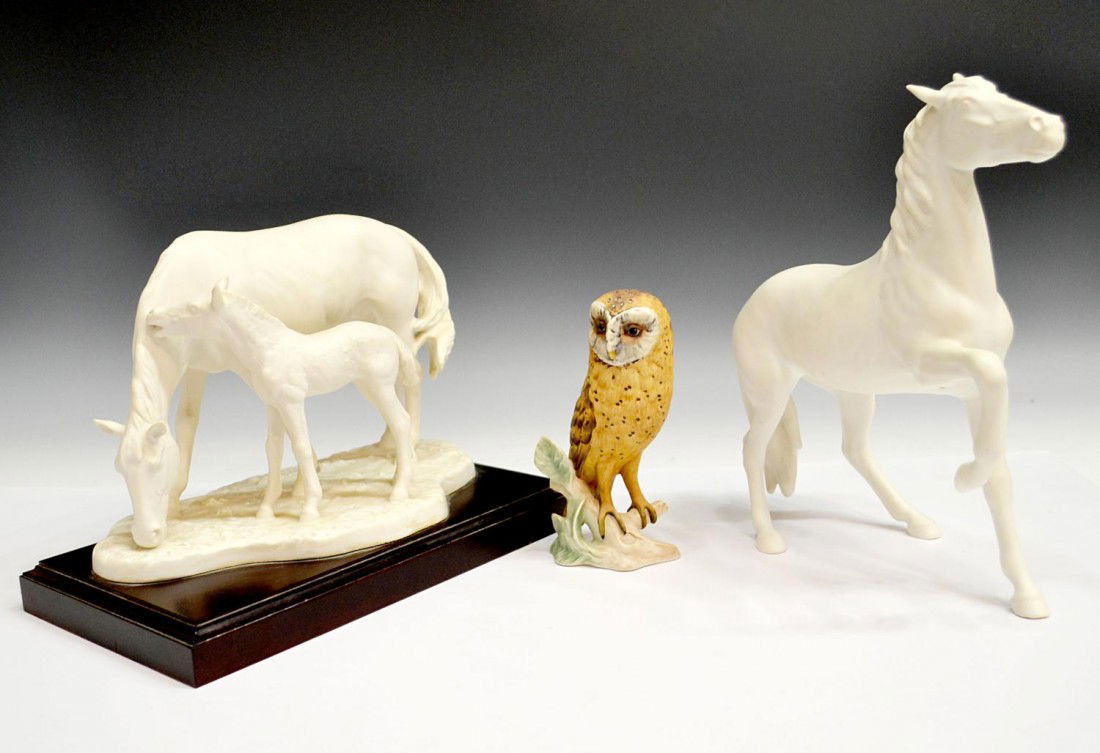 LARGE GOEBEL LIMITED EDITION MARE & FOAL, HORSES: (lot of 3) Goebel figures: (1) Limited edition mare and foal, signed G. Borhmann, on a wood base, numbered 355/950, 8"h,11"l, 6"w; (1) horse figure in white, 10.25"h, 9.5"l; (1) polychrome bisque figu