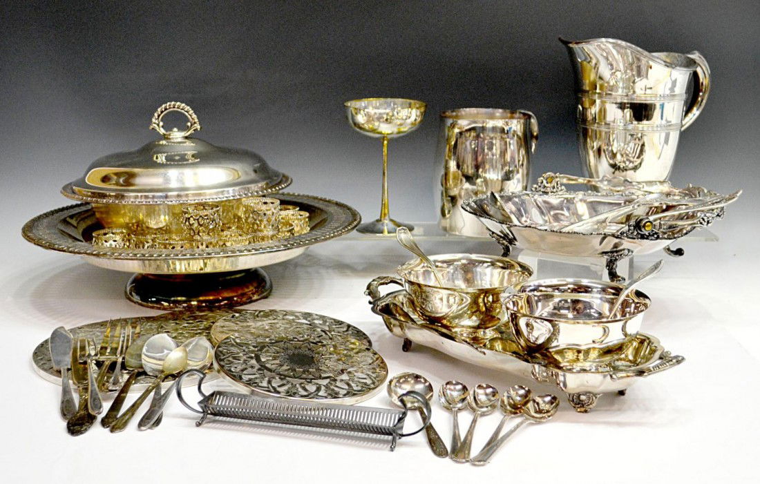 HUGE COLLECTION SILVER PLATE SERVICE & TABLEWARE: (lot) Huge collection of silver plate service and assorted flatware pieces including napkin ring holders, pitchers, covered dishes, trivets of graduated size, etc., 16.25lbs total Start Price: $80.00