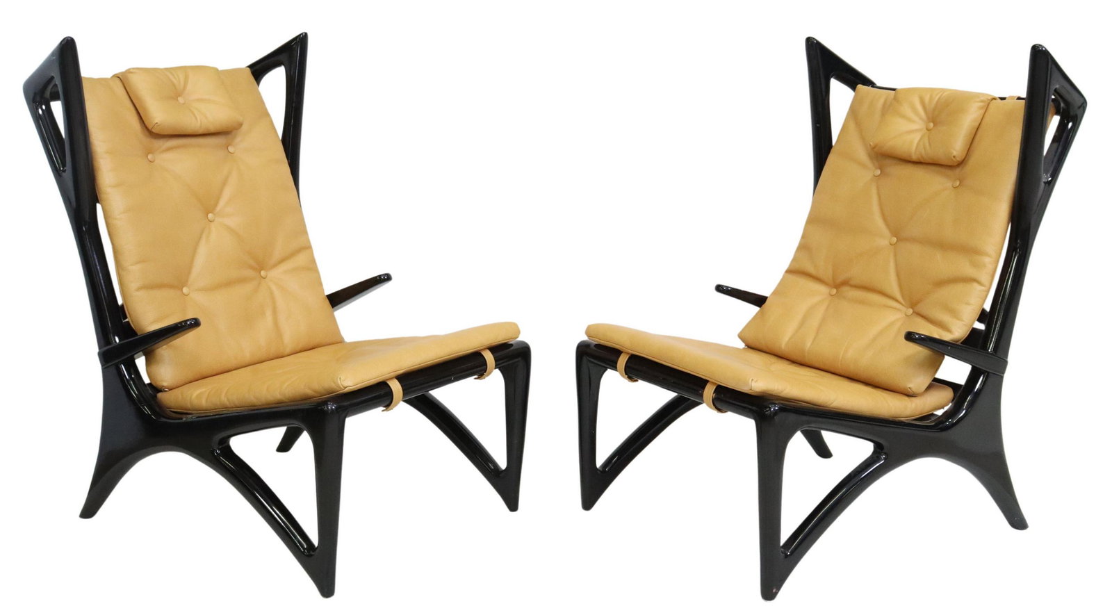 (2) ITALIAN MID-CENTURY MODERN LOUNGE CHAIRS: (pair) Italian mid-century modern lounge chairs, c.1950s, sculptural wingback frame in an ebonized finish, button-tufted leather cushion, rising on tapered legs, wear to finish, approx 42"h, 27.5"w, 3