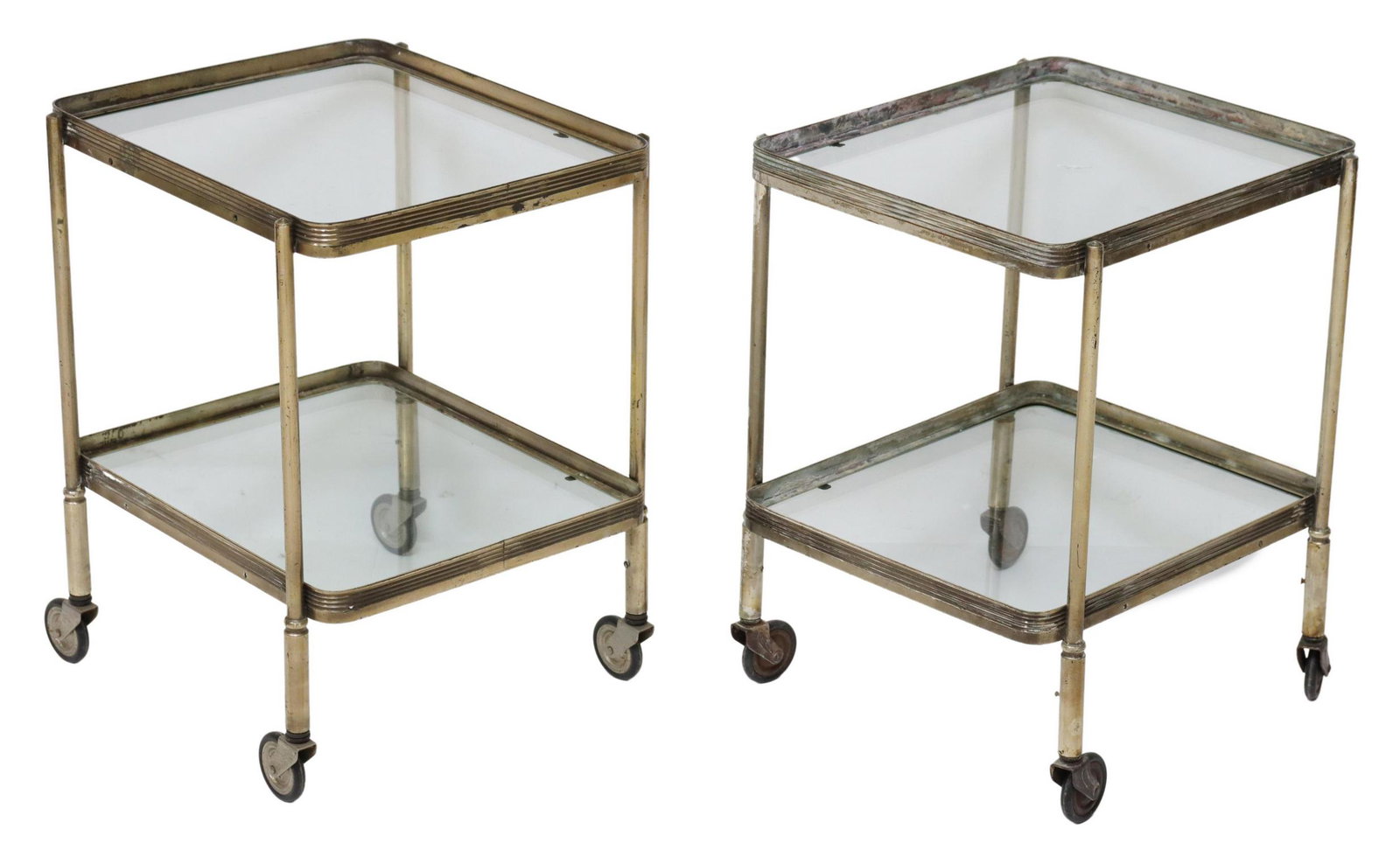 2) DIMINUTIVE MODERN TIERED METAL SERVICE CARTS: (pair) Diminutive Italian modern silver-tone metal service carts, c.1970s, each with two-tiers, rounded corners, rising on casters, approx 16.75"h, 13.25"w, 12.25"d Start Price: $100.00