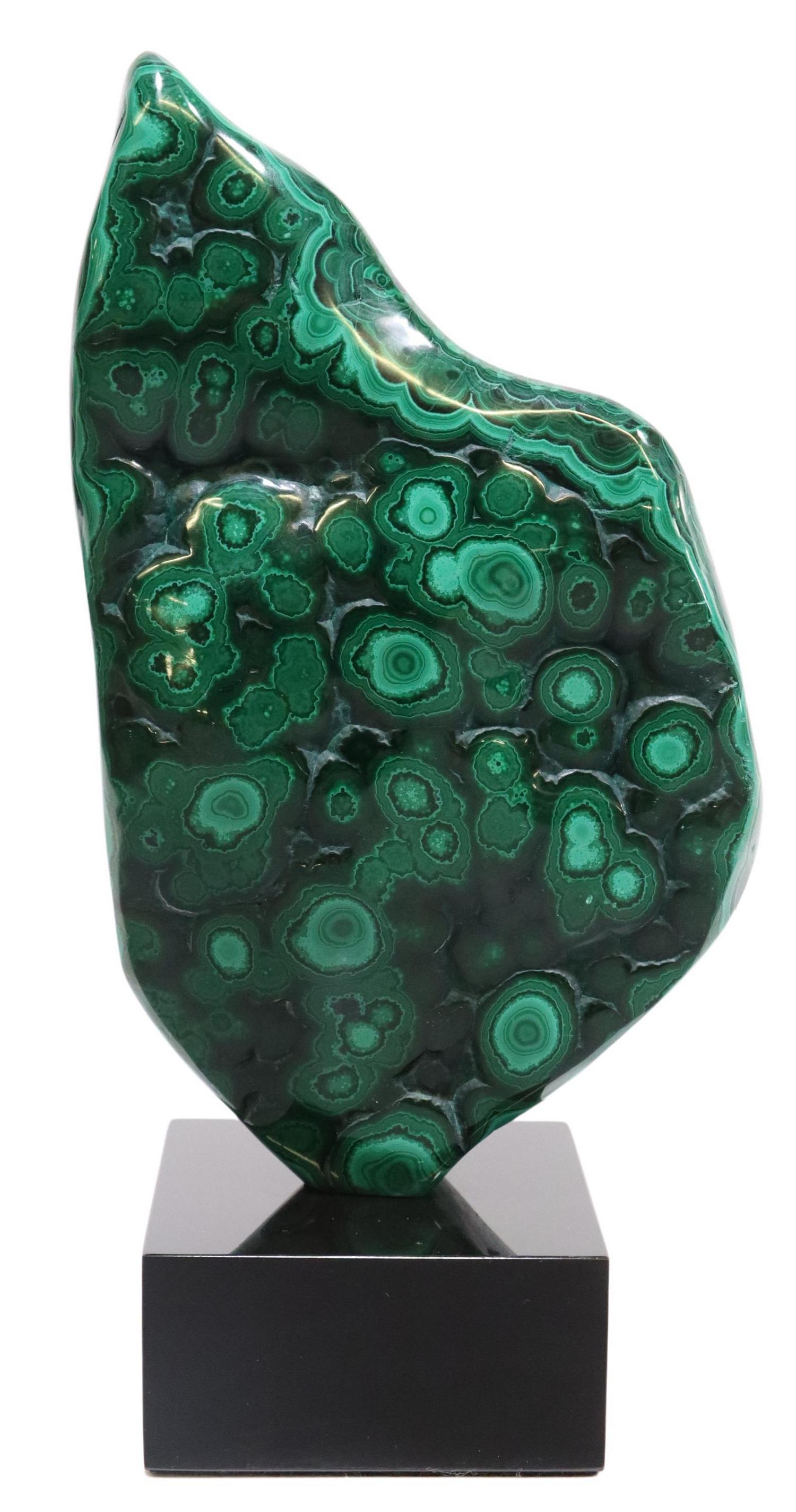 POLISHED MALACHITE SPECIMEN ON BLACK MARBLE BASE: Polished malachite specimen, Congo, mounted on black marble base, specimen: approx 8"h, 5"w, 1"d, overall: approx 9.5"h", 5"w, 3"d, 4lbs Start Price: $100.00