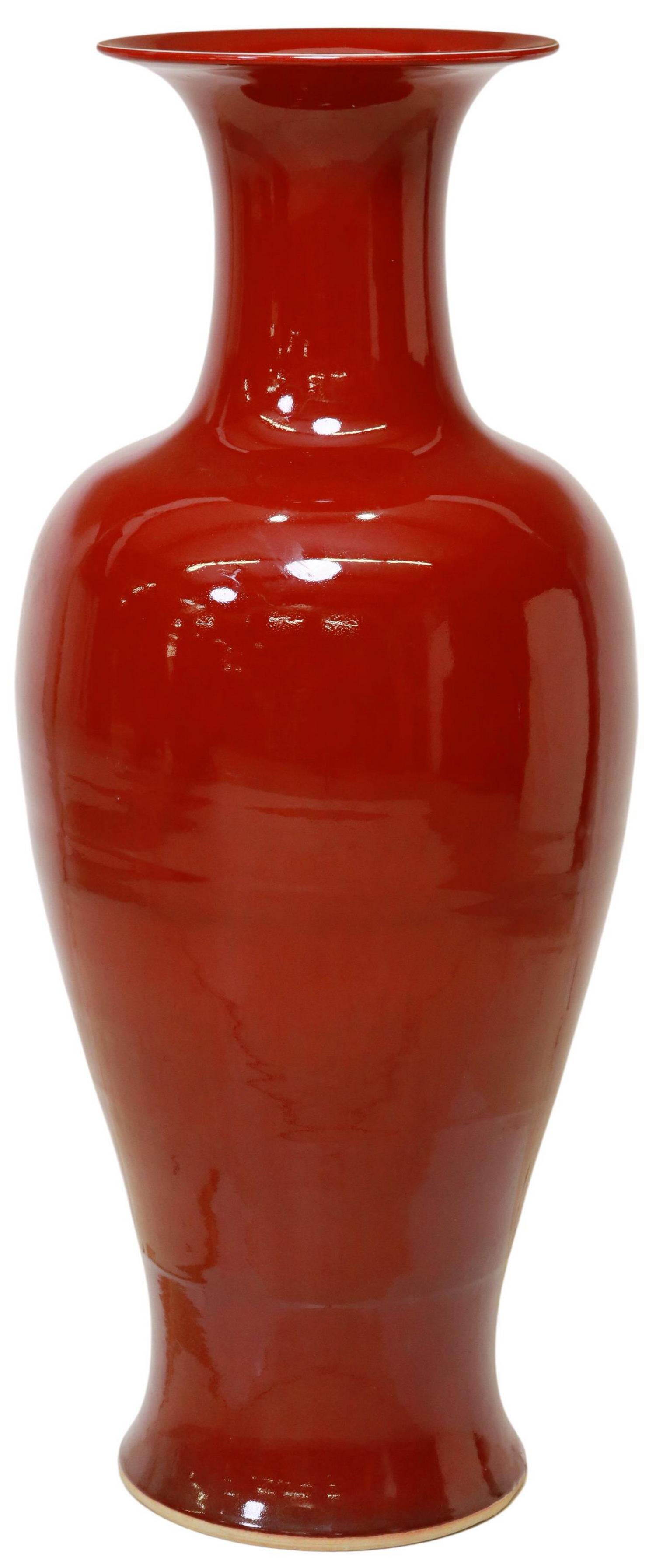 LARGE CHINESE SANG DE BOEUF GLAZED CERAMIC VASE: Large Chinese sang de boeuf (oxblood) glazed ceramic vase, having flared rim, over elongated bulbous body, approx 36.5"h, 12.5"diam Start Price: $300.00