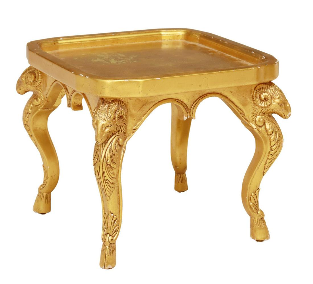 BAROQUE STYLE GILT RAM'S HEAD OCCASIONAL TABLE: Baroque style gilt occasional table, 20th c., having shaped and recessed top, rising on ram's head cabriole legs, ending on hoof feet, some gilt loss, approx 19.5"h, 22"sq **Provenance: from a high-en