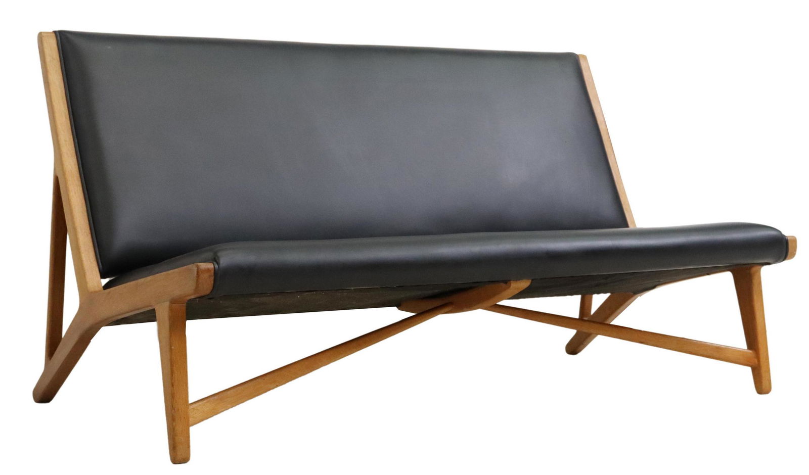 HANS WEGNER (ATTR.) MID-CENTURY OAK ARMLESS SETTEE: Mid-century modern armless sofa/ settee, attributed to Hans Wegner (Danish, 1914-2007) for Johannes Hansen, model JH 555, c.1950s, oak frame, black upholstery, rising on tapered legs, apparently unmar