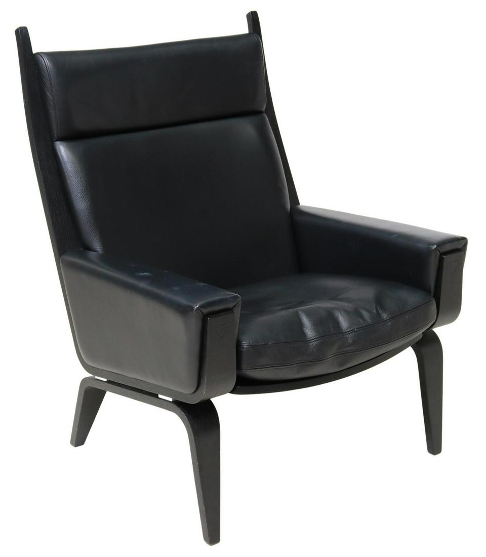HANS WEGNER FOR GETAMA 'GE-501A' LOUNGE CHAIR: Contemporary Scandinavian "GE-501A" highback armchair, Getama, 21st c., original design by Hans Wegner in 1967, having curvilinear wood frame, black grained leather upholstery, removable seat cushion,