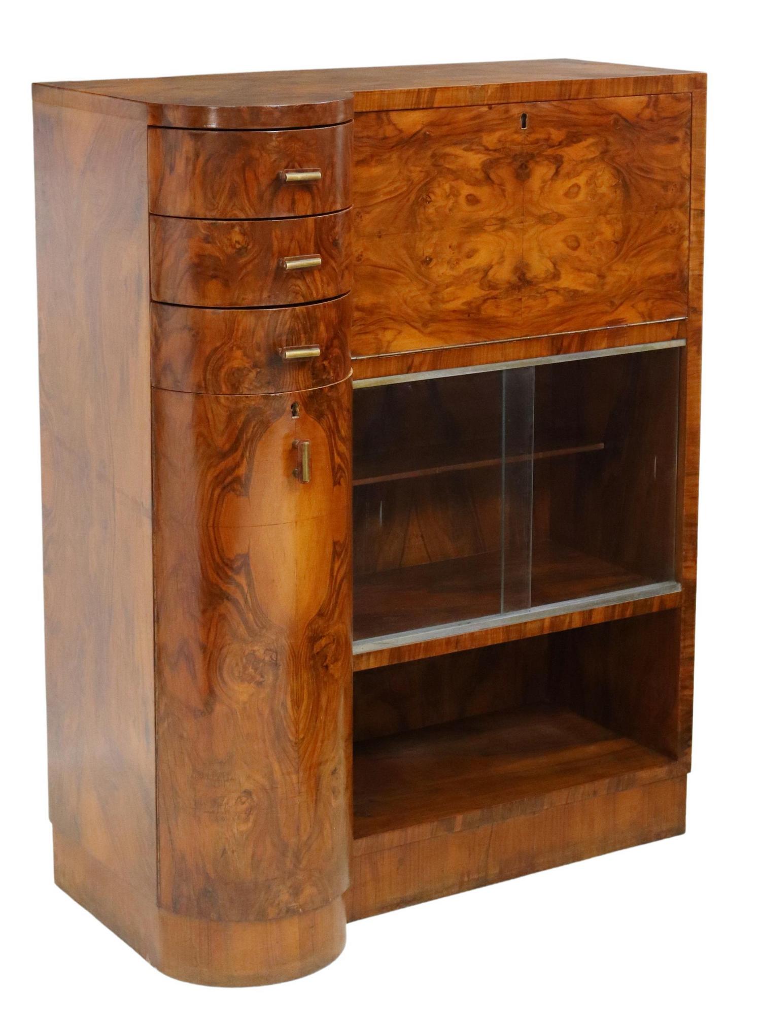 ITALIAN ART DECO BURLED WALNUT CABINET: Italian Art Deco burled walnut sideboard, c.1930s, having asymmetrical shaped case, right side with drop front, over two lower cabinets, left fitted with three drawers over lower shelved cabinet, risi