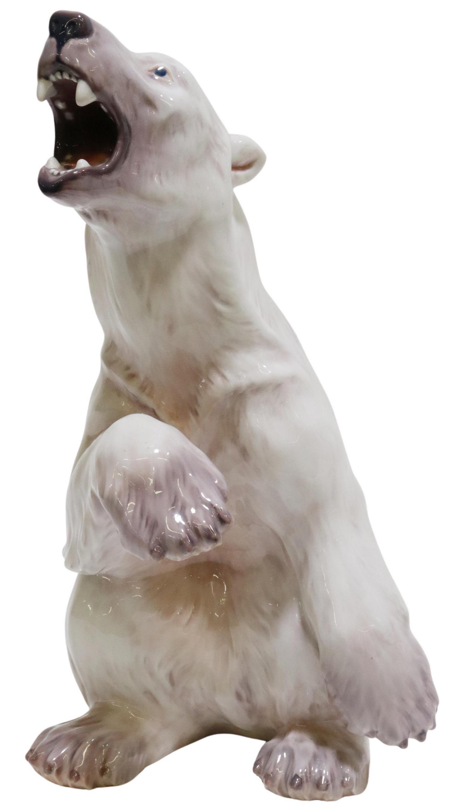 DAHL JENSEN (D.1960) PORCELAIN POLAR BEAR FIGURE: Large porcelain polar bear sculpture, Dahl Jensen (Jens Peter Dahl-Jensen, 1874-1960), Copenhagen, Denmark, model 1157, seated bear with raised paw, marked underfoot, approx 14.5"h, 7"w, 8"d, 6.5lbs S