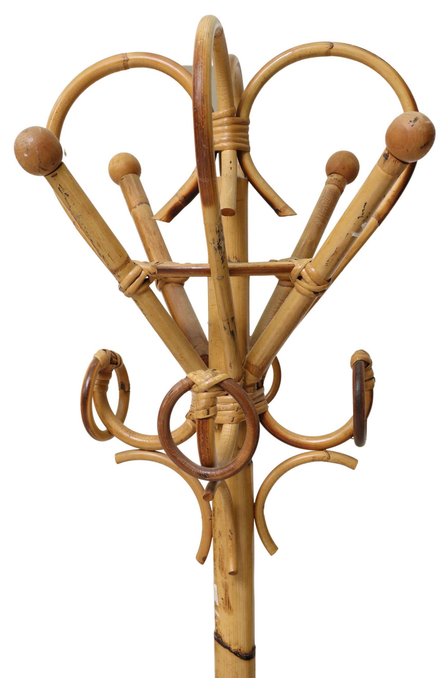 BAMBOO FOUR-HOOK STANDING HALL TREE: Bamboo hall tree, 20th c., having curvilinear top with four hat/coat hooks, straight bamboo standard, rising on four flared feet, approx 67"h, 27"w, 18"d Start Price: $100.00