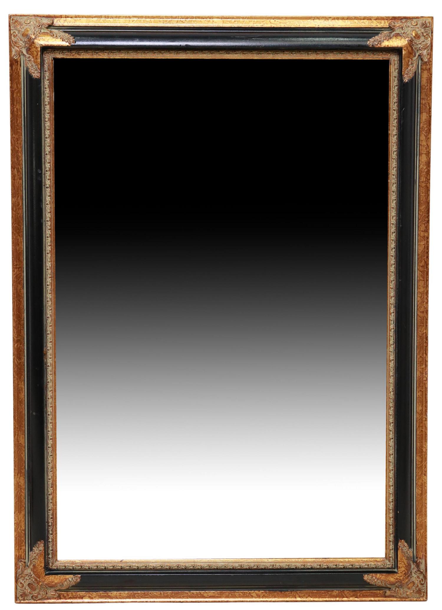 DECORATIVE PARCEL EBONIZED & FOLIATE WALL MIRROR: Decorative wall mirror, 20th/21st c., having parcel ebonized frame, with foliate corner accents, encasing beveled mirror plate, approx 41.75"h, 29.75"w, 22.5lbs **Provenance: from a high-end downtown 
