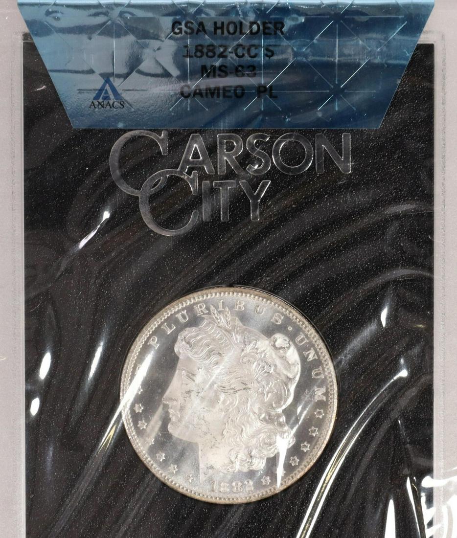 US 1882 GSA CARSON CITY SILVER DOLLAR, MS63 CAMEO: U.S.1882 GSA Carson City Uncirculated Silver Dollar graded by ANACS MS-63, Cameo, PL, housed in original GSA sealed packaging **PLEASE NOTE: ALL coin / currency purchases totaling $300 or more MUST BE