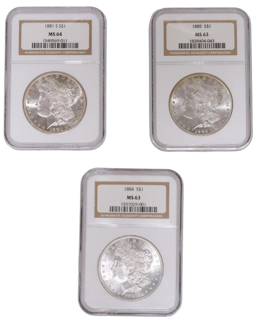 (3) US MORGAN SILVER DOLLARS, NGC 64 & 63: (lot of 3) (lot of 3) US Morgan Graded Silver Dollars, all in plastic slabs: (1) 1881-S, NGC MS 64; (1) 1884, NGC MS 63; (1) 1885, NGC MS 63 **PLEASE NOTE: ALL coin / currency purchases totaling $300 