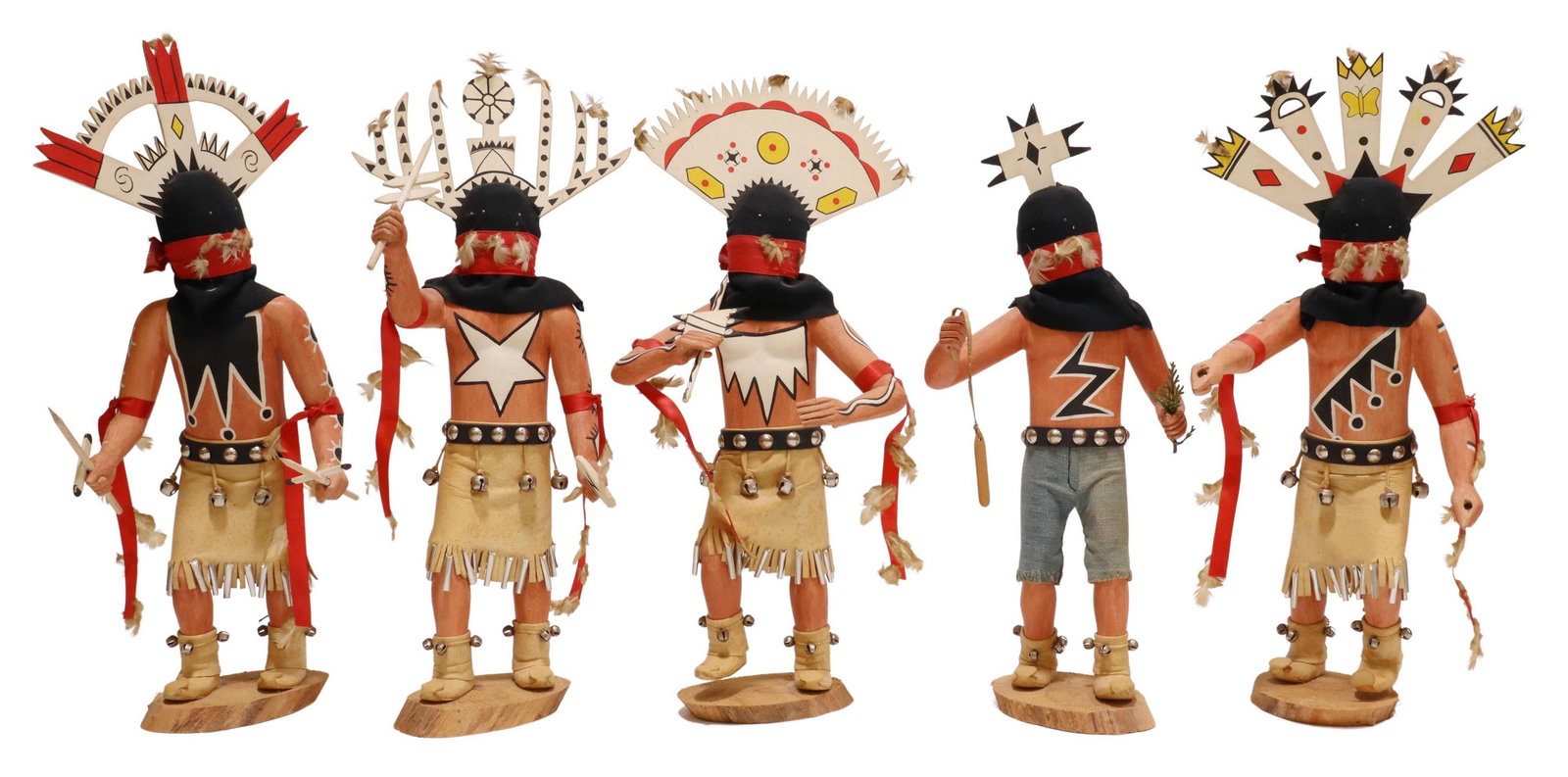 (5) APACHE MOUNTAIN SPIRIT CROWN DANCER KACHINAS: (lot of 5) Carved and polychrome painted wood Kachina dolls, each depicting an Apache Mountain Spirit Dancer, including: (4) in leather skirts with metal embellishments, one lacking spear, one intact 