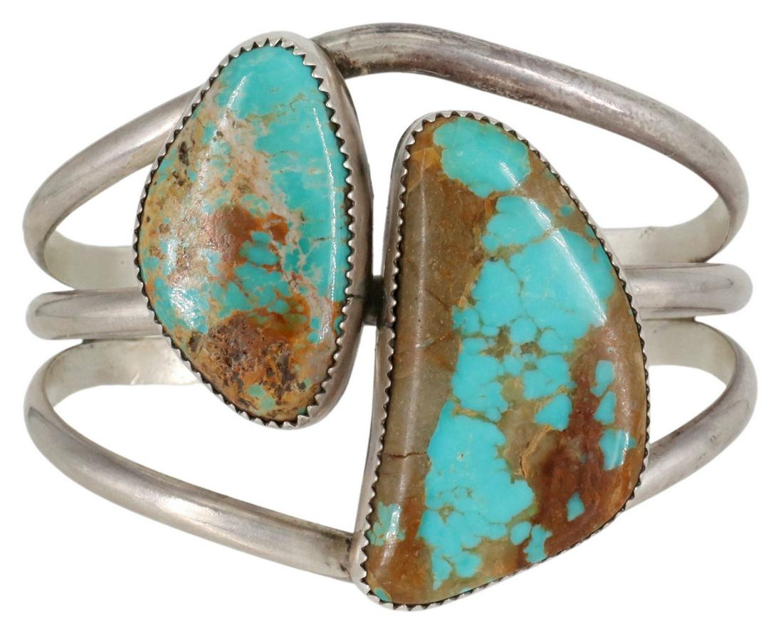 NATIVE AMERICAN STERLING & TURQUOISE CUFF BRACELET: Native American sterling silver cuff bracelet, signed JR, possibly Johnson Ralph (Navajo/ Dine, 20th c.), two bezel-set turquoise stones, on a split shank cuff, approx 1.75"w, interior (end to end): a