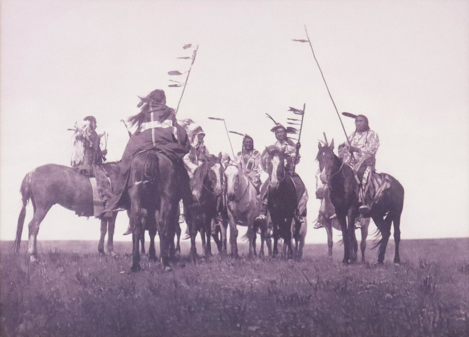 AFTER EDWARD CURTIS (D.1952) ATSINA WARRIORS PRINT: Framed print on paper, "Atsina Warriors," after Edward Sheriff Curtis (American, 1868-1952), sight: approx 13.75"h, 19.25"w, overall: 27"h, 32.5"w, 13lbs Start Price: $80.00