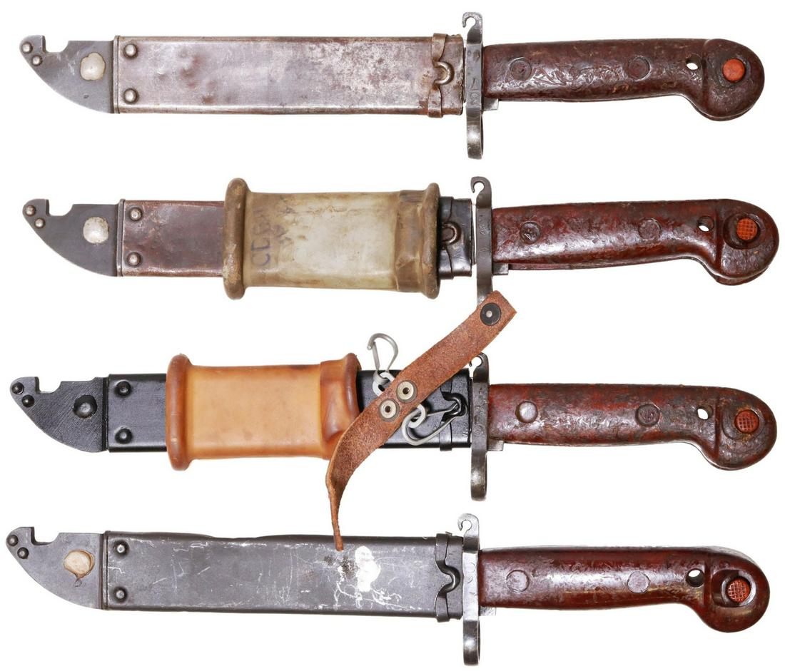 (4) RUSSIAN-ROMANIA AKM-1 SAWBACK BLADE BAYONETS: (lot of 4) Russian Kalashnikov AKM 1 sawback blade bayonets, Romania, each with 5.75" blade, central cutout, wire cutting loop at guard, wood handle with push button release, steel sheath, overall: 13