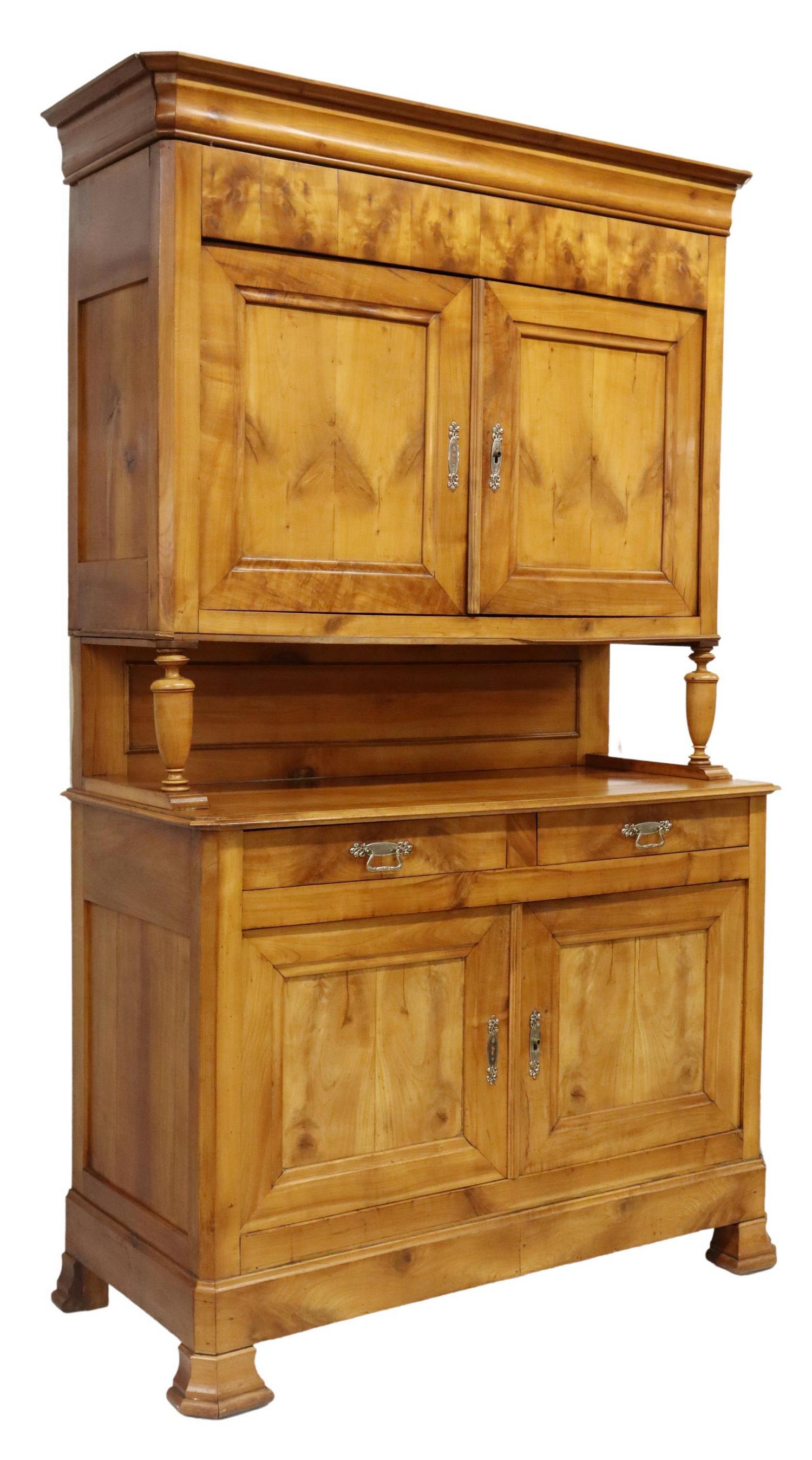 FRENCH LOUIS PHILIPPE PERIOD FRUITWOOD SIDEBOARD: French Louis Philippe period fruitwood sideboard, mid 19th c., having molded cornice, over paneled deux corps case, dual top cabinets, on turned supports, above lower case fitted with two drawers and 