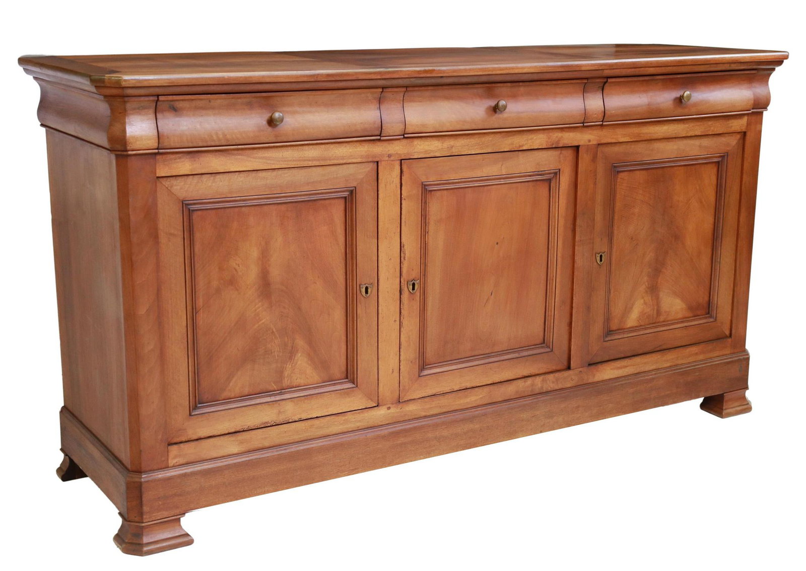 FRENCH LOUIS PHILIPPE PERIOD WALNUT SIDEBOARD: French Louis Philippe period walnut sideboard, mid 19th c., ogee frieze with three drawers, over three paneled cabinet doors, interior shelf, rising on bracket feet, approx 41.5"h, 77.5"w, 22.5"d Star