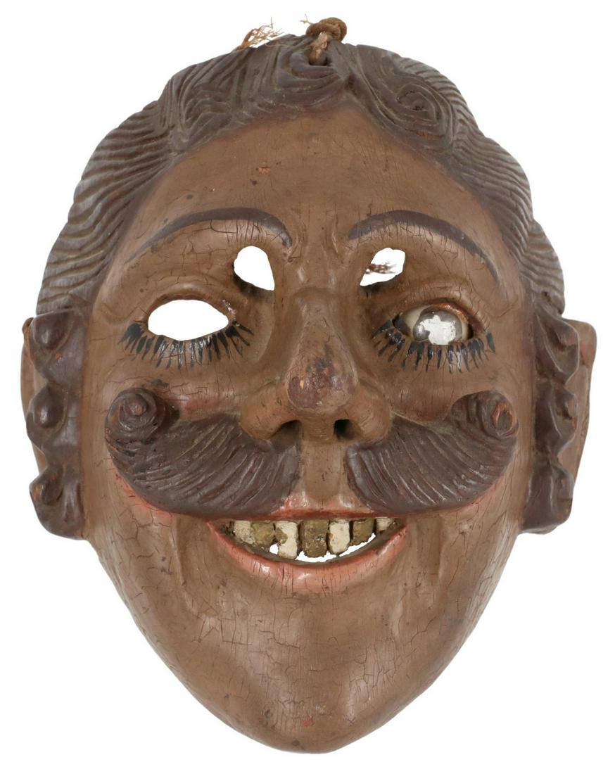CARVED WOOD CONQUISTADOR DANCE MASK, GUATEMALA: Folk art carved and painted wood conquistador dance mask, Guatemala, depicting smiling man with mustache, single inlaid glass eye, approx 7"h, 5.5"w, 4.5"d, 0.1lbs Start Price: $300.00