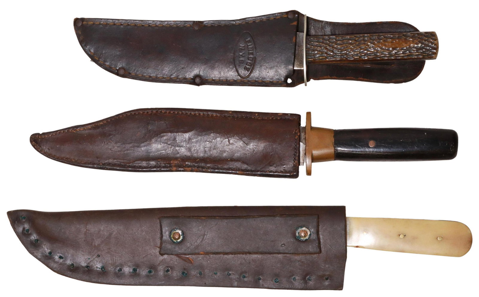 (3) VINTAGE BOWIE KNIVES: (lot of 3) Bowie knives: (1) clip point 6.75" blade marked at the ricasso in an oval "Finedge, Ostiso (New York), aluminum guard, stag three pin handle, housed in Finedge sheath, overall approx. 11"l;