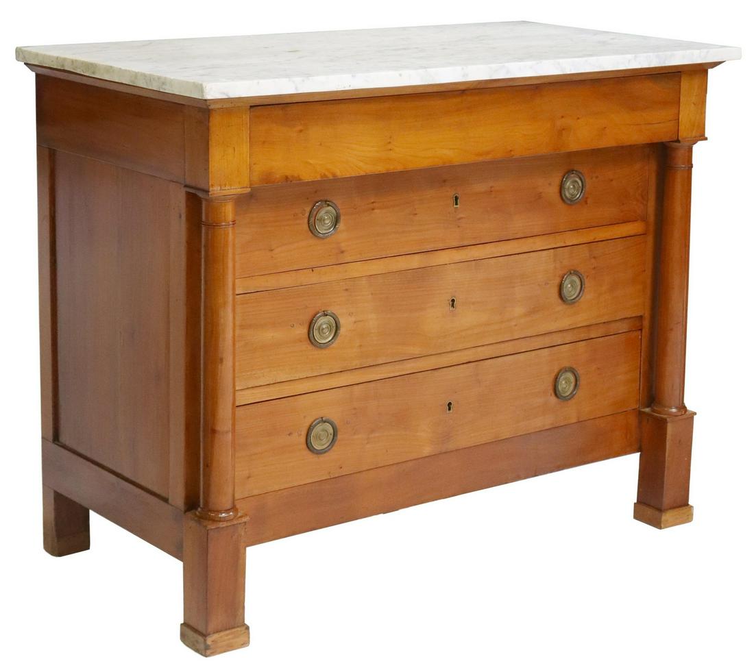 FRENCH EMPIRE STYLE MARBLE-TOP FRUITWOOD COMMODE: French Empire style marble-top fruitwood commode, 19th c., having four drawers flanked by turned columns, rising on squared supports, approx 36"h, 46"w, 24"d Start Price: $450.00
