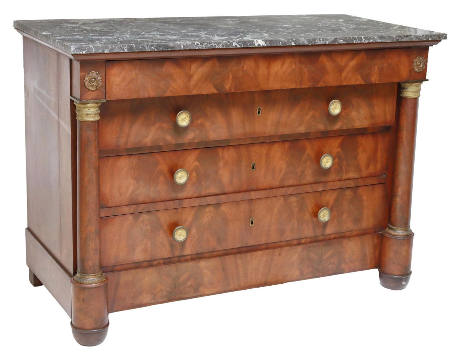 FRENCH EMPIRE STYLE MARBLE-TOP MAHOGANY COMMODE: French Empire style flame mahogany commode, 20th c., having marble top, frieze drawer, over three additional drawers, flanked by turned columnar supports with gilt metal capital, rising on cup feet, a