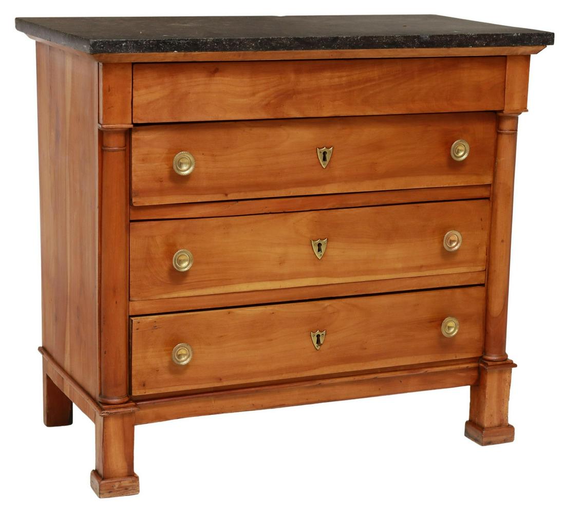 FRENCH EMPIRE STYLE MARBLE-TOP FRUITWOOD COMMODE: French Empire style marble-top commode, late 19th/ early 20th c., fruitwood case, fitted with frieze drawer, over three additional drawers, flanked by turned pilasters, rising on block pedestal legs,