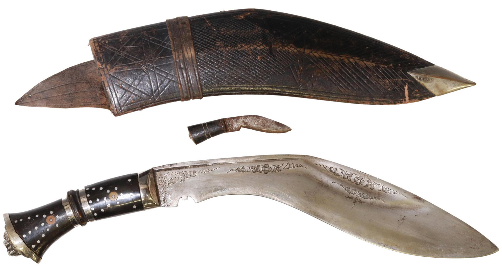 INDIA GURKA KNIFE: India Ghurka knife, 20th c., a 9.5" blade with foliate engraving at one side, notch near handle, black handle with inset silver tone acents, a lion mask at pommel, housed in leather sheath with one sm
