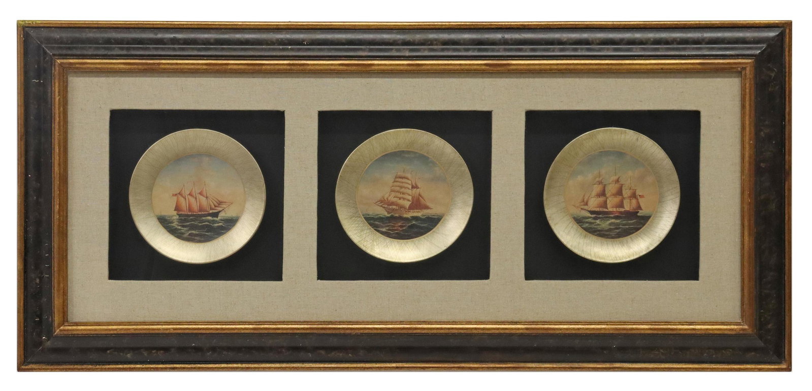 DECORATIVE CLIPPER SHIP PLATES IN SHADOWBOX FRAME: Decorative plates housed in a shadowbox frame, 21st c., three plates with printed images of full-rigged ships, each plate: approx 8"diam, overall: 21.25"h, 45.5"w Start Price: $50.00