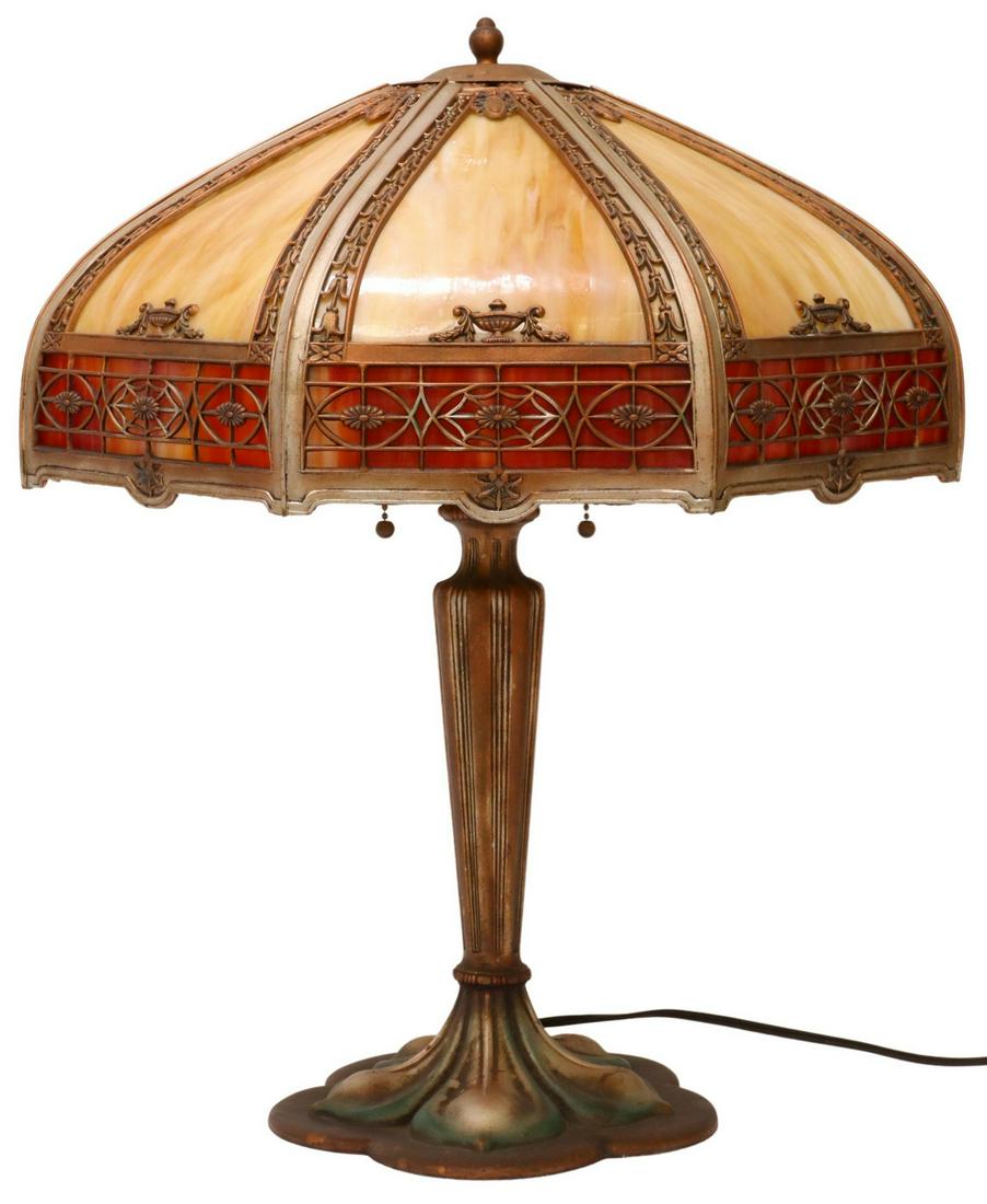 AMERICAN SLAG GLASS TWO-LIGHT TABLE LAMP: American slag glass table lamp, early 20th c., octagonal shade with slag glass panes, pierced overlay with bellflowers, urns, two lights, painted metal base, (one) glass pane in border of shade intact