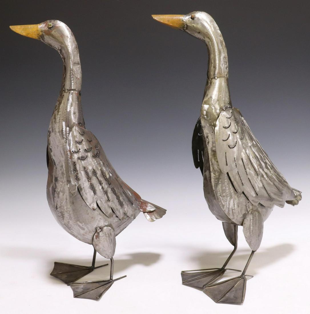 (2) RUSTIC SHEET METAL GEESE SCULPTURES, 20.25"H: (pair) Rustic sheet metal geese sculptures, late 20th c., having textured feathers, with painted beaks and eyes, approx 20.25"h, 13.25"w, 8.75"d, 2lbs total Start Price: $80.00