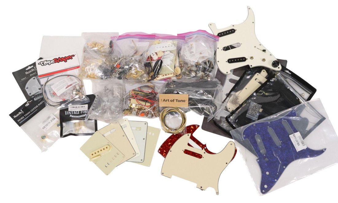 (LOT) ASSORTED GUITAR PARTS & WIRING: (lot) Large collection of assorted guitar parts including wiring, pots, pickups, pickup covers, knobs, tremolo bars, screws, switches and more, **Provenance: an Austin, Texas collection**