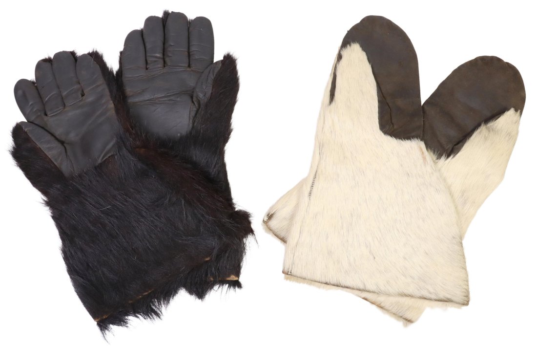 (TWO PAIR) ARCTIC TYPE GLOVES, BLACK & WHITE FUR: (2 pair) Arctic type gloves: (1) pair black hair on hide, leather hand front four fingers and thumb, partially fabric lined; approx. 14.5"l; (1) pair white hair on leather, mitten style hand with thum